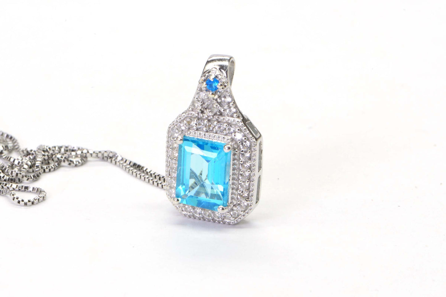 Emerald Cut Blue Topaz Sterling Silver Halo Pendant Necklace (18 inch)