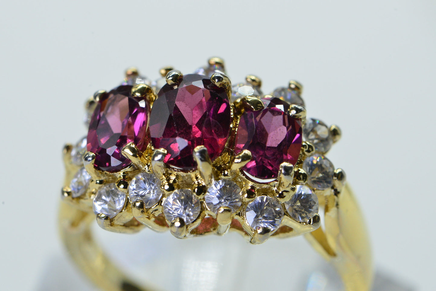Vintage Garnet Trilogy Ring: 24K Gold Over Sterling Silver, Simulated Diamond Halo