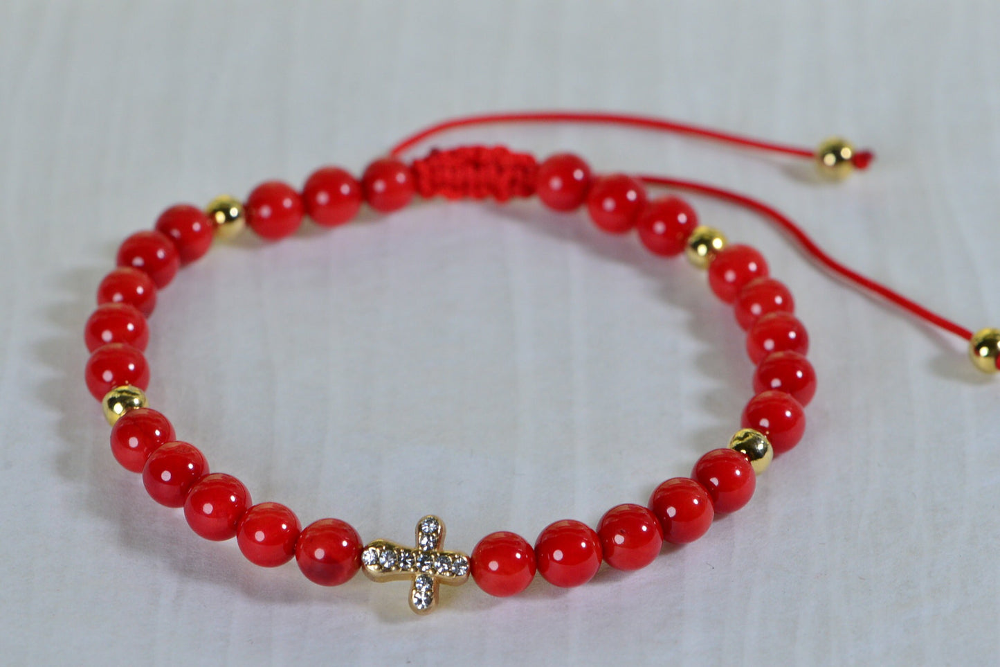 Red Coral Macrame Bracelet: Adjustable Knotted Cord, Gold Cross