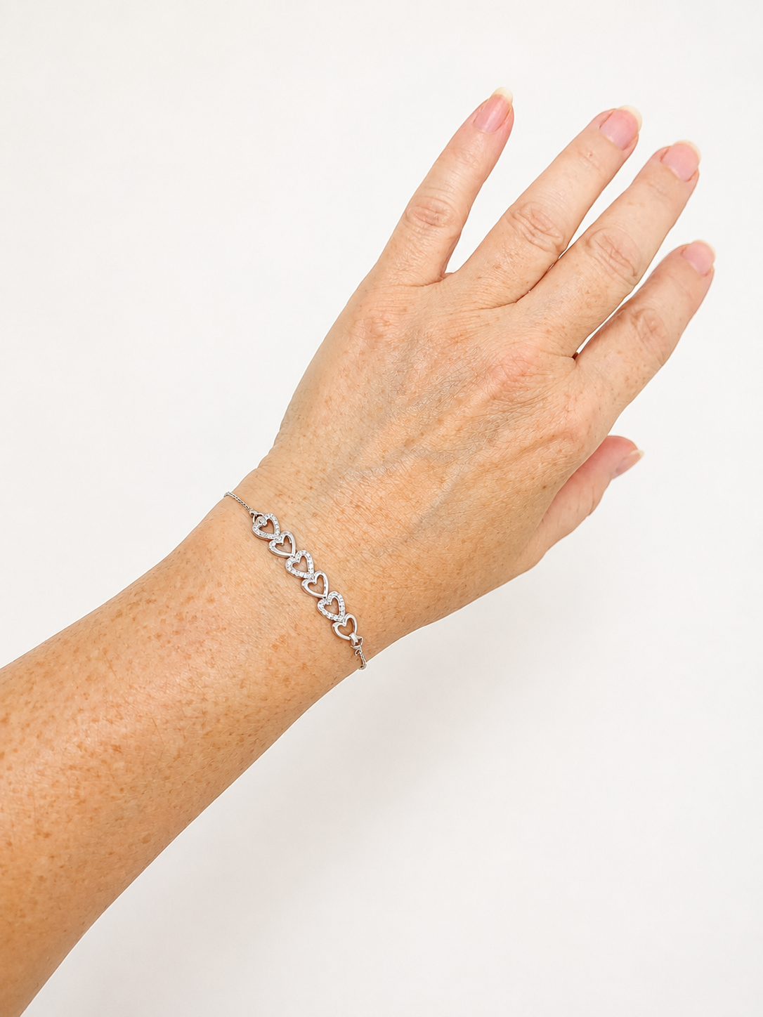 Diamond Six Heart Bracelet: 14k White Gold over Sterling Silver