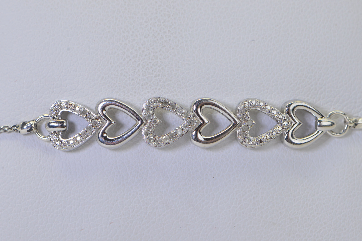Diamond Six Heart Bracelet: 14k White Gold over Sterling Silver