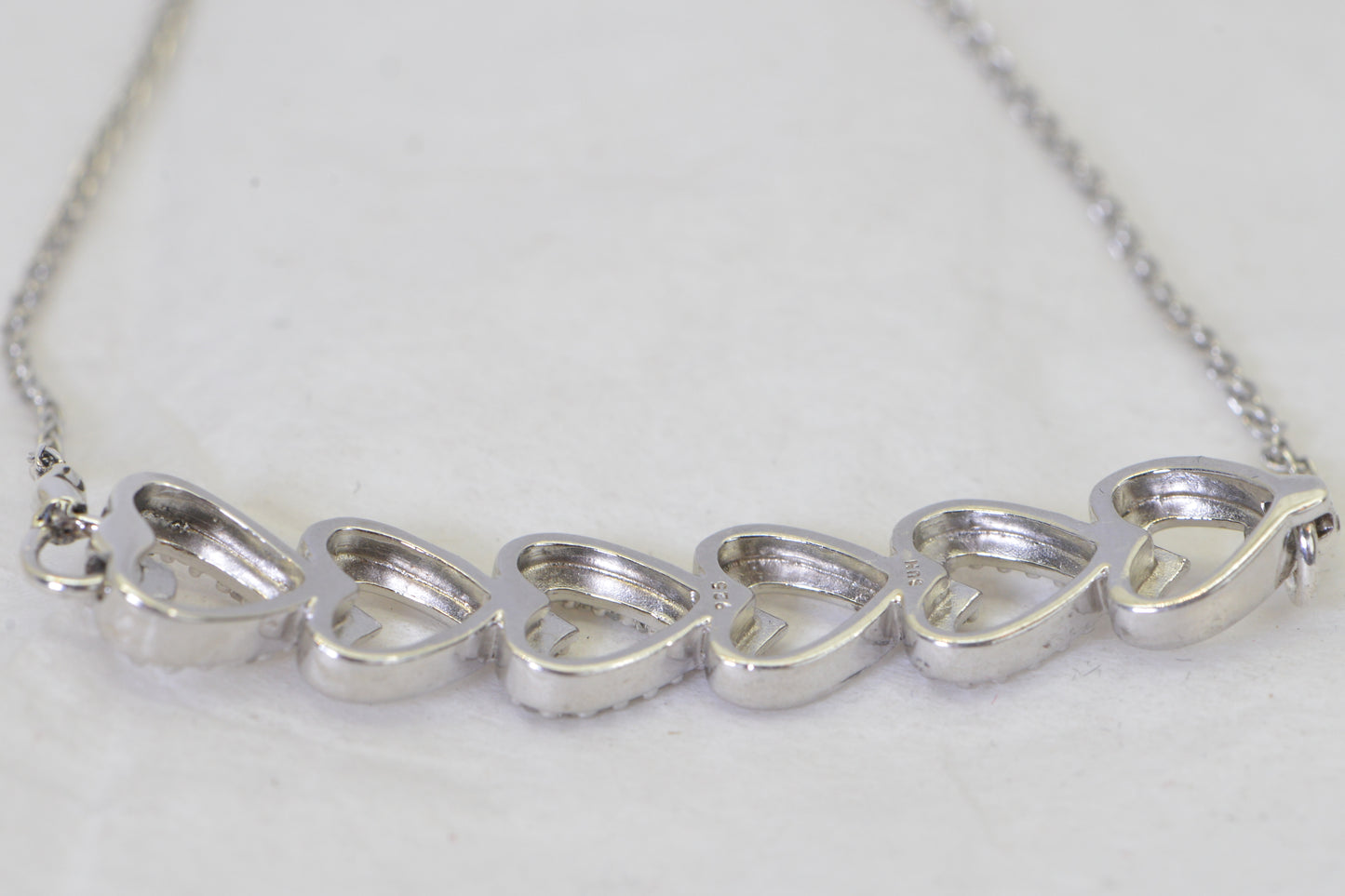 Diamond Six Heart Bracelet: 14k White Gold over Sterling Silver