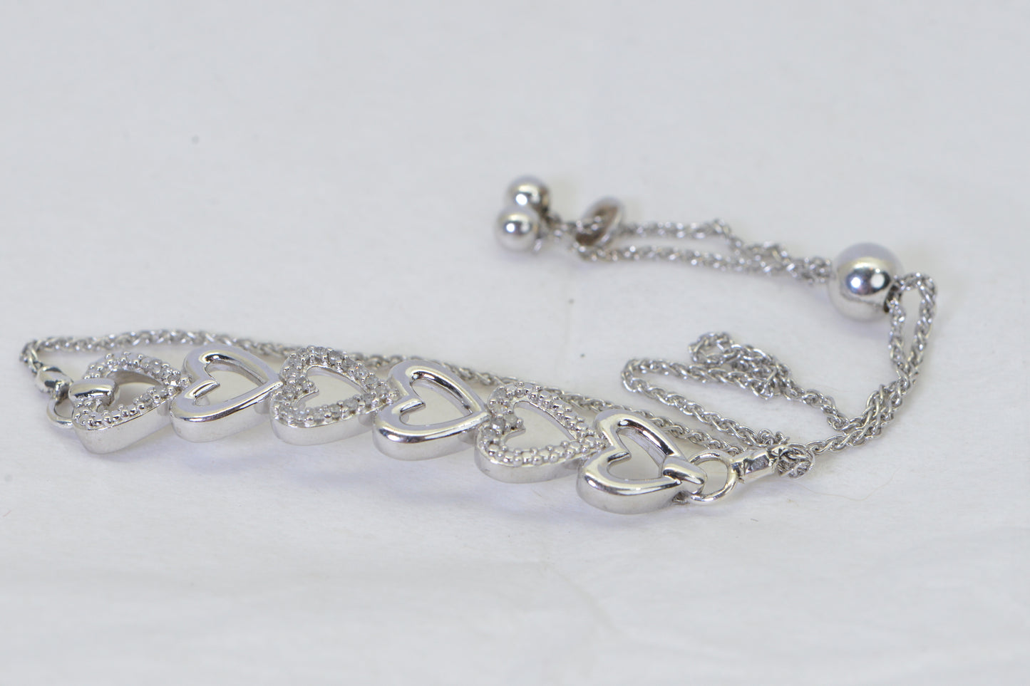 Diamond Six Heart Bracelet: 14k White Gold over Sterling Silver