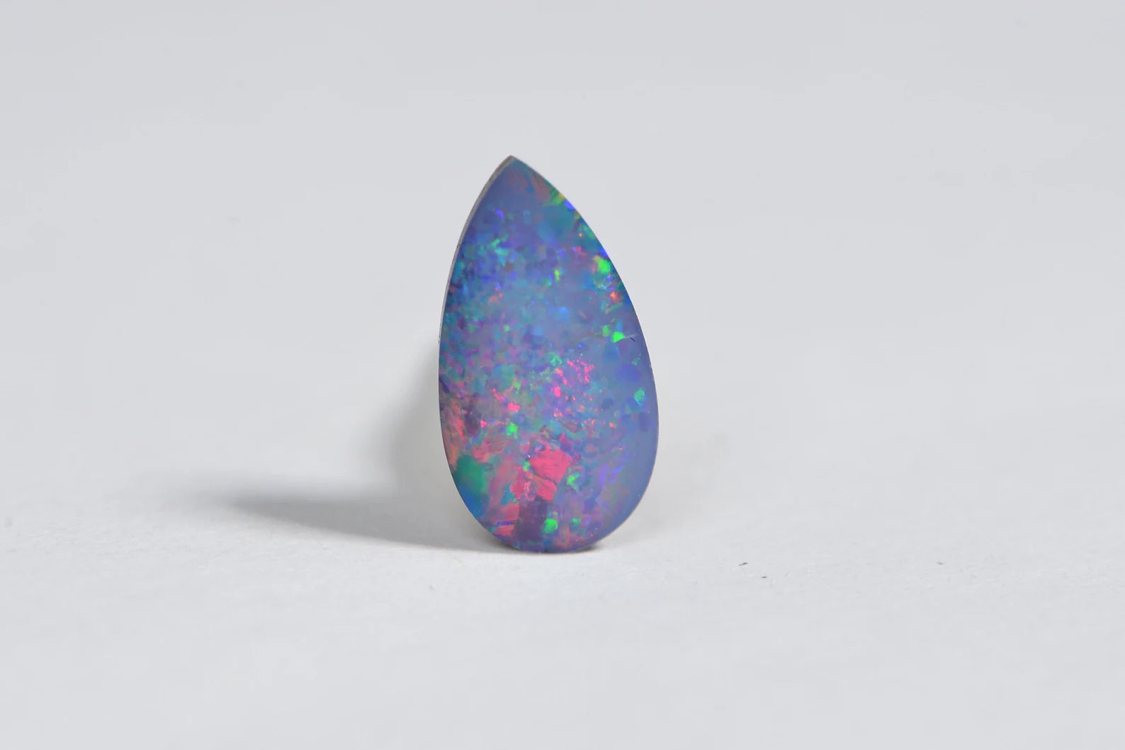 Australian Black Opal Doublet: 0.85CT Pear Cabochon, Blue Broad Flash (11X6mm)