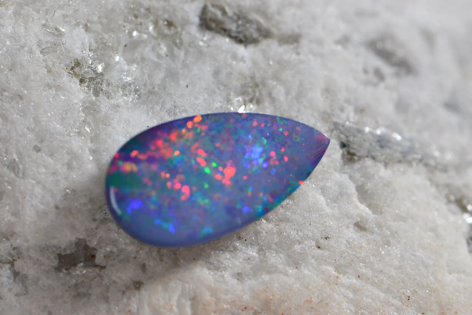 Australian Black Opal Doublet: 0.85CT Pear Cabochon, Blue Broad Flash (11X6mm)