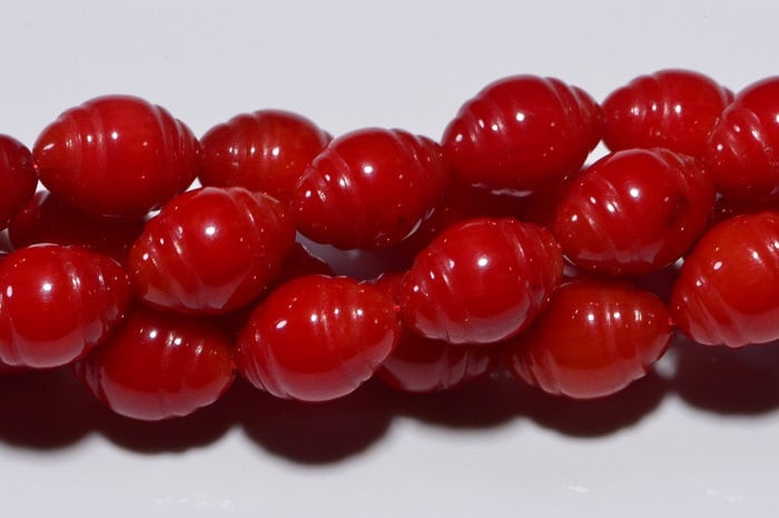 Coral Red Oval Beads: Carved Gemstone Jewelry Supplies (8.5x6mm)