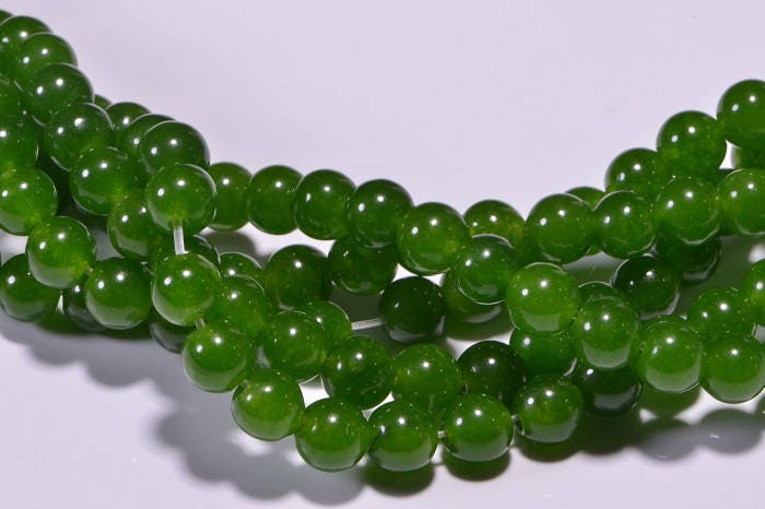 5.4mm AA Translucent Green Jade Beads: 15" Strand