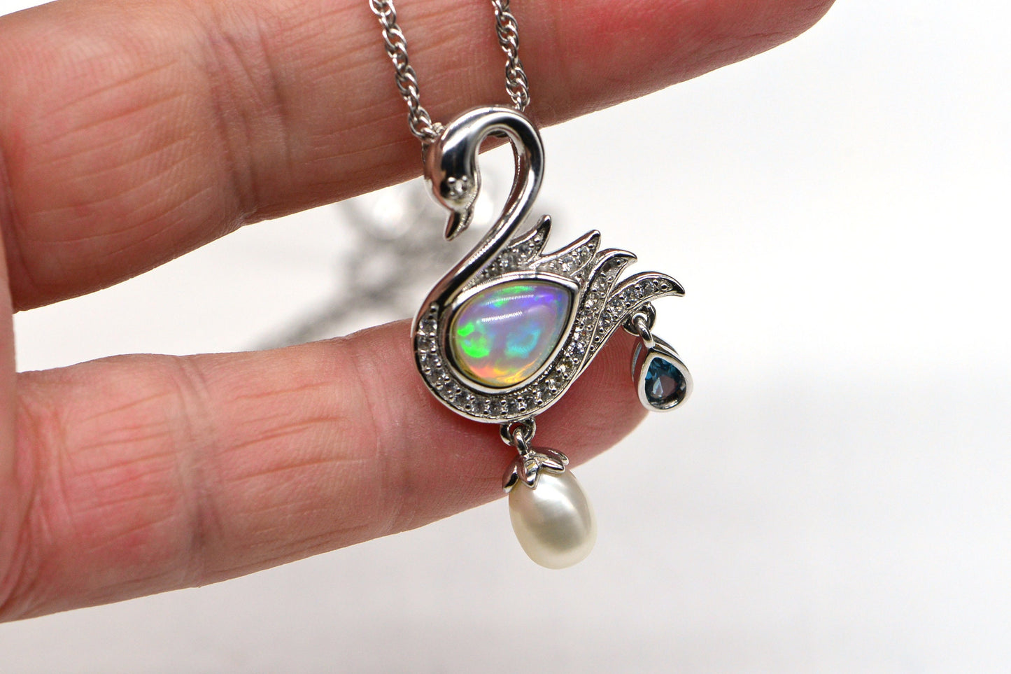 Welo Opal Swan Pendant: 14K White Gold Over Sterling Silver, Pearl & Topaz Accent