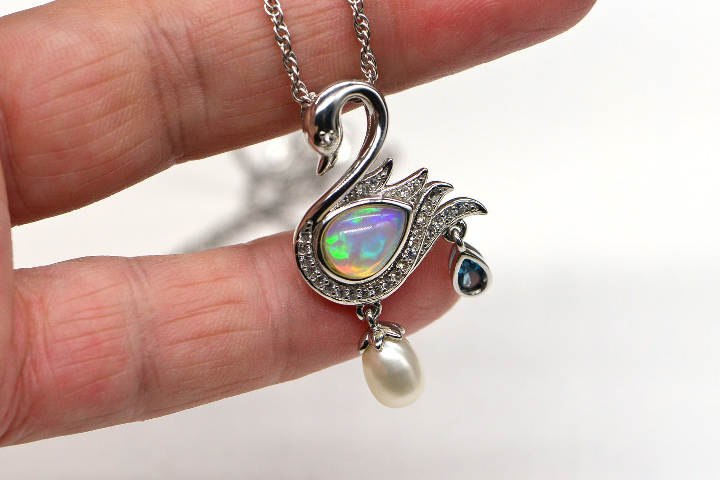 Welo Opal Swan Pendant: 14K White Gold Over Sterling Silver, Pearl & Topaz Accent
