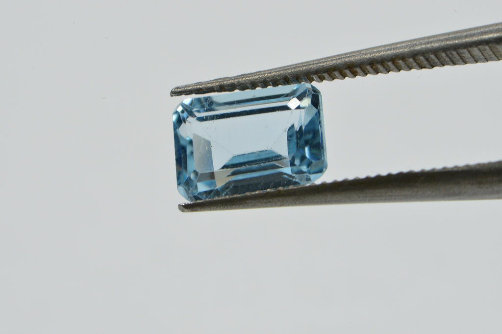 Natural Aqua Blue Topaz Gemstone: Emerald Faceted Cut, 1.25 Carat