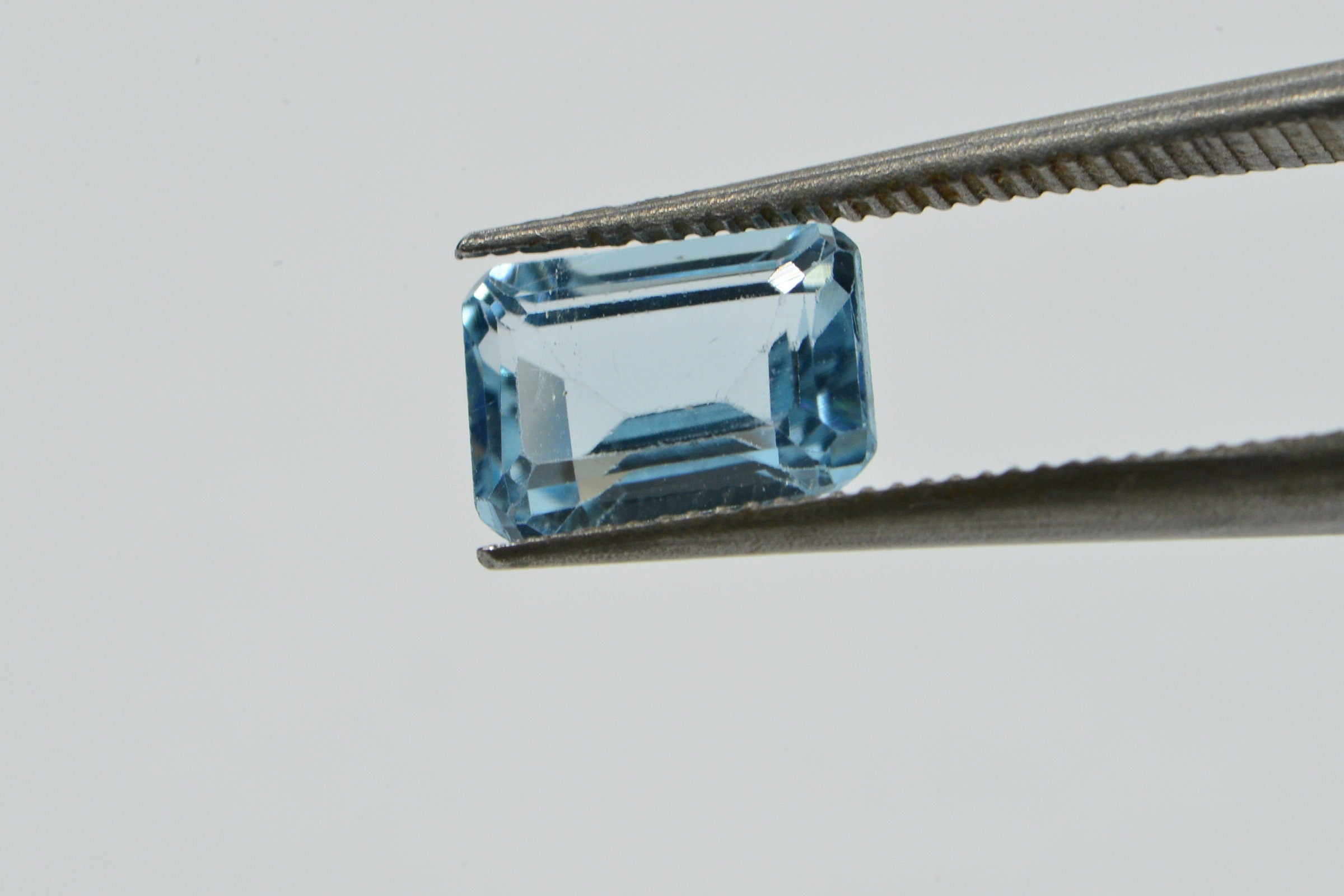 Natural Aqua Blue Topaz Gemstone: Emerald Faceted Cut, 1.25 Carat