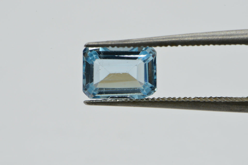 Natural Aqua Blue Topaz Gemstone: Emerald Faceted Cut, 1.25 Carat