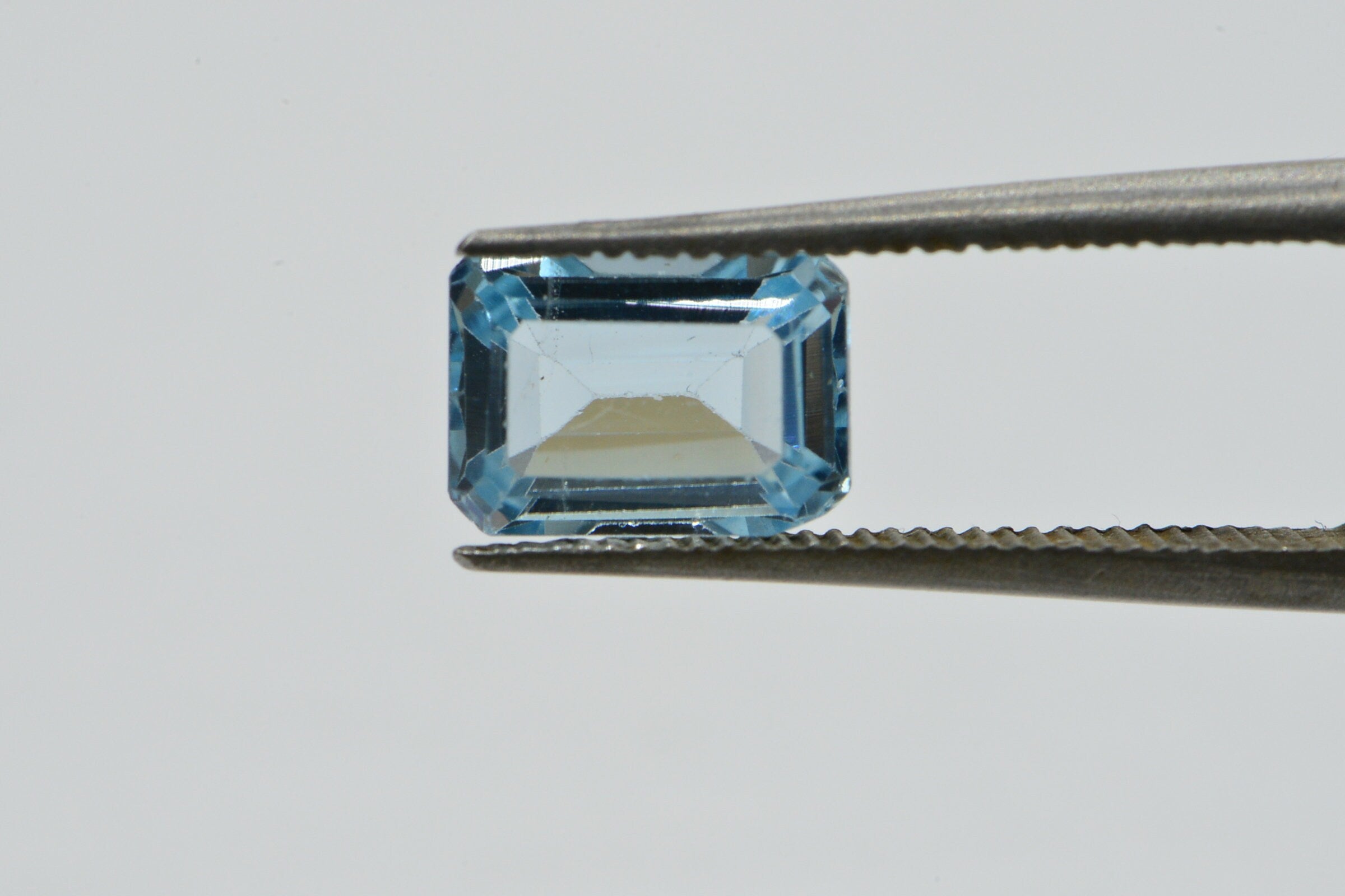 Natural Aqua Blue Topaz Gemstone: Emerald Faceted Cut, 1.25 Carat