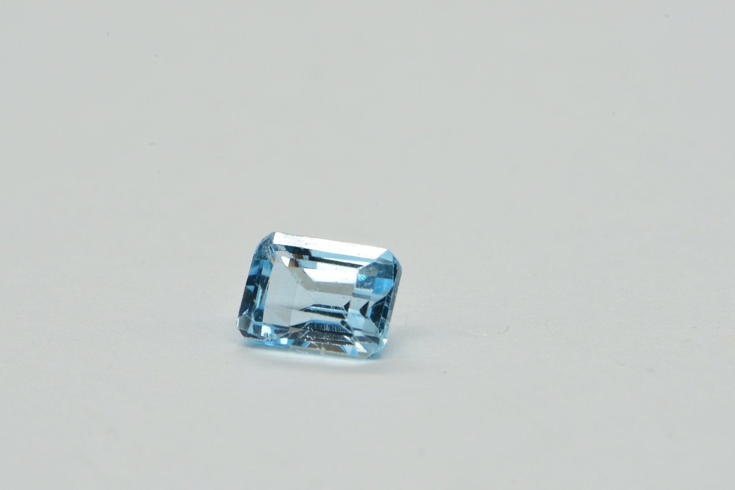 Natural Aqua Blue Topaz Gemstone: Emerald Faceted Cut, 1.25 Carat