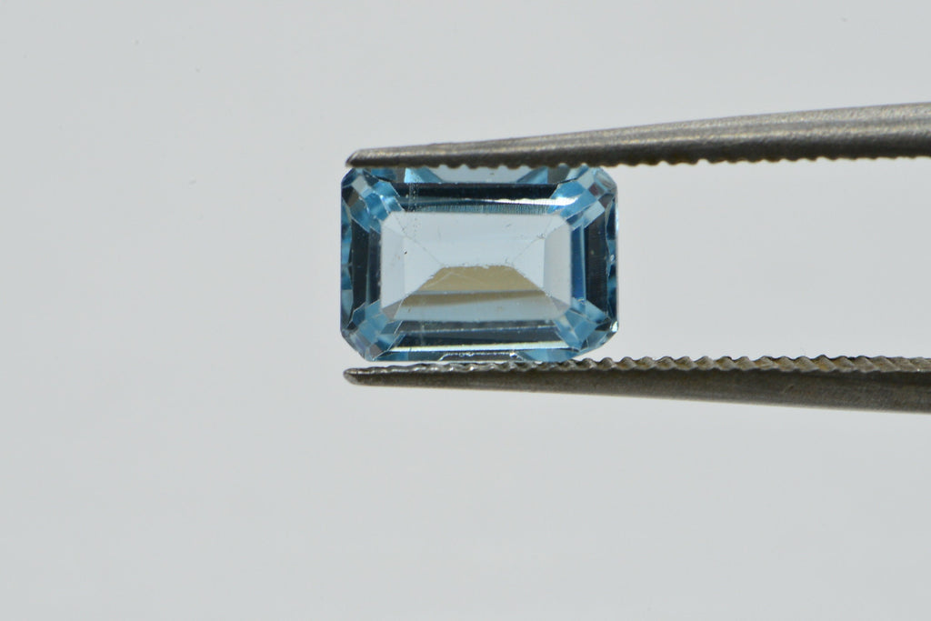 Natural Aqua Blue Topaz Gemstone: Emerald Faceted Cut, 1.25 Carat