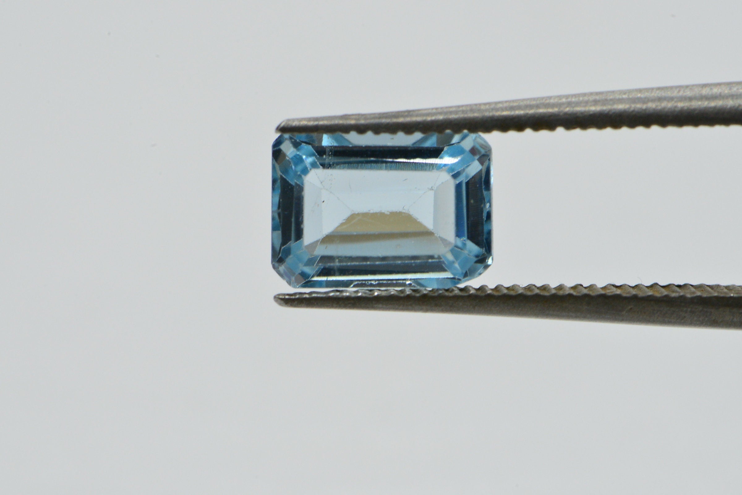 Natural Aqua Blue Topaz Gemstone: Emerald Faceted Cut, 1.25 Carat