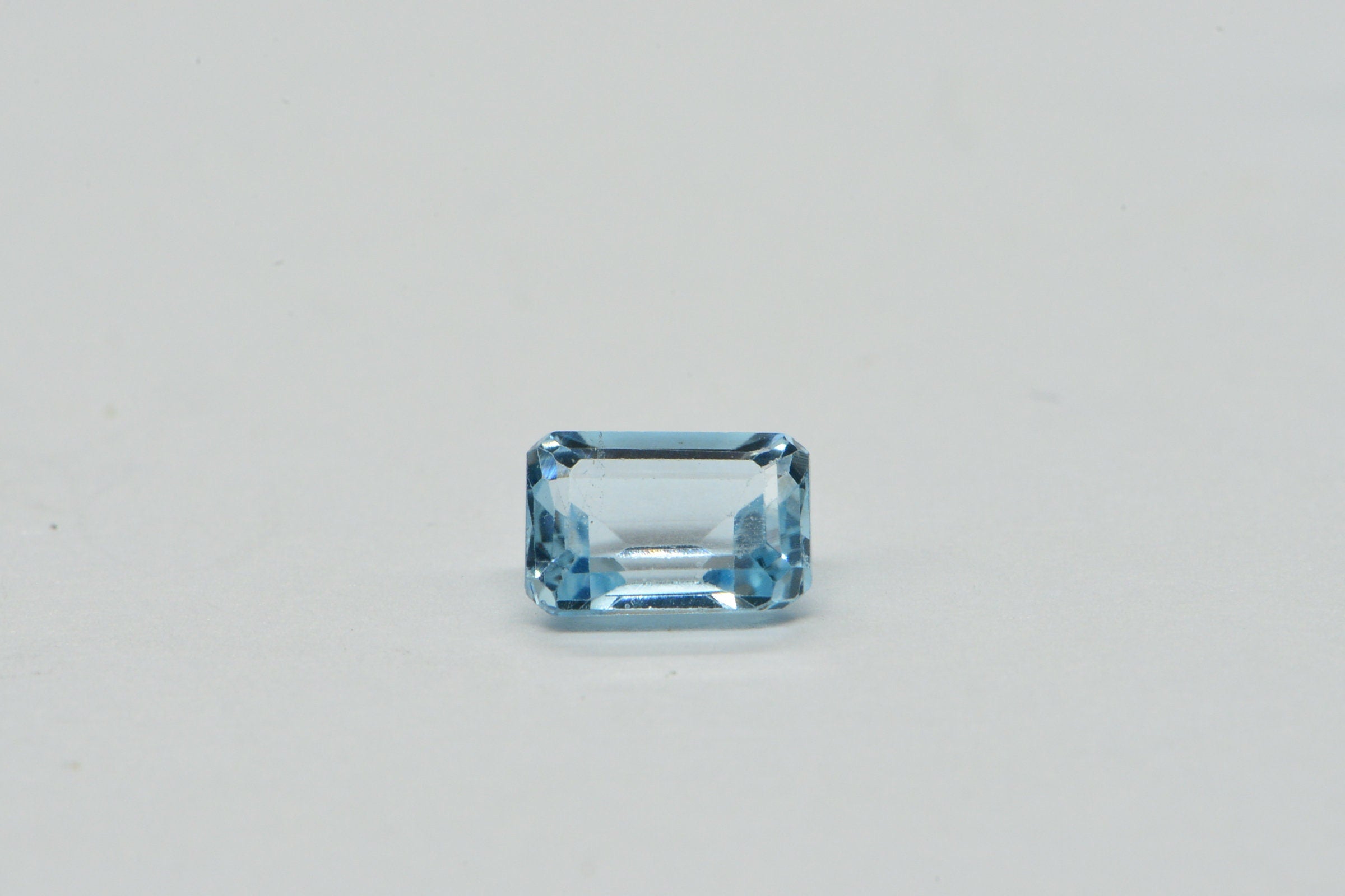 Natural Aqua Blue Topaz Gemstone: Emerald Faceted Cut, 1.25 Carat