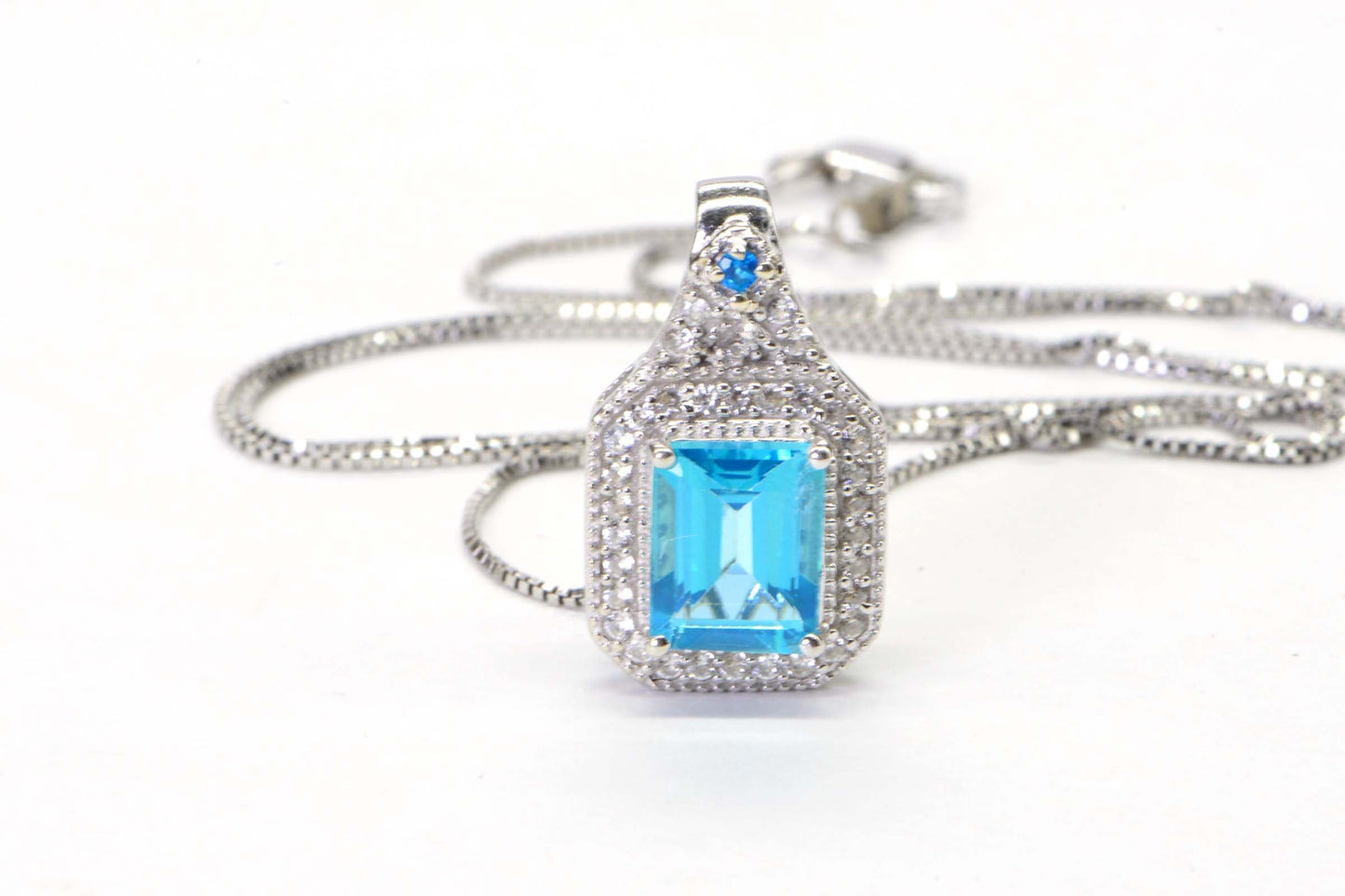 Emerald Cut Blue Topaz Sterling Silver Halo Pendant Necklace (18 inch)