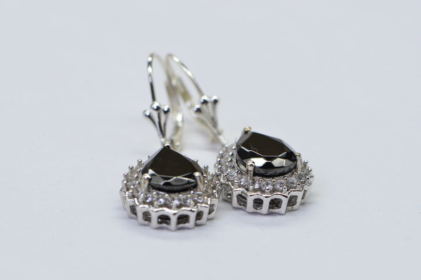 Black Spinel Teardrop Earrings: Sterling Silver Halo Design