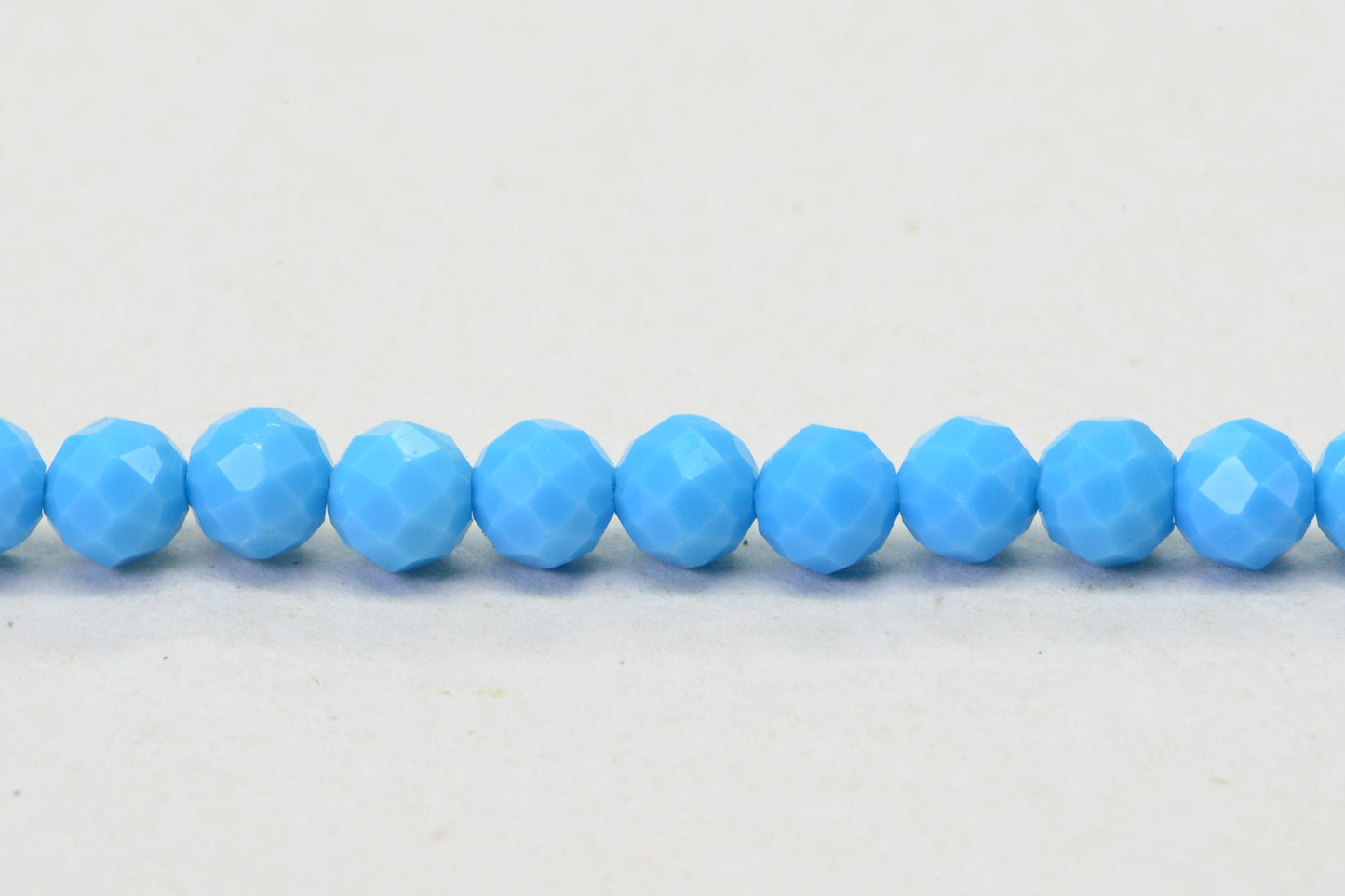 Sleeping Beauty Turquoise Beads: 4mm Round Faceted Sky Blue Strand