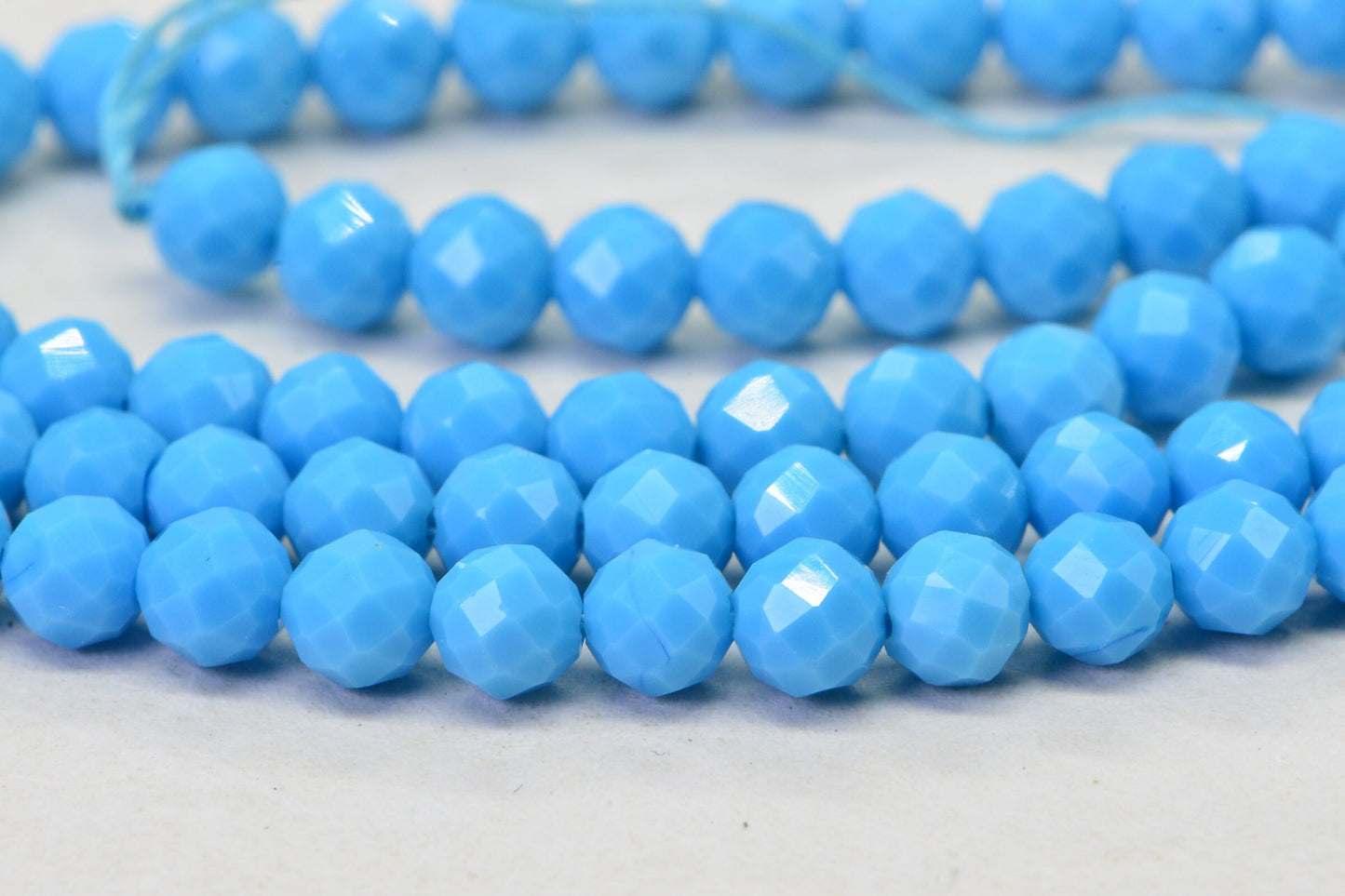 Sleeping Beauty Turquoise Beads: 4mm Round Faceted Sky Blue Strand