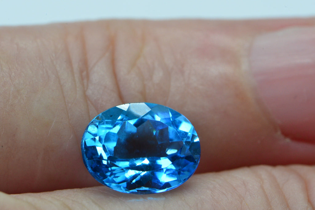 AAA Blue Topaz: Oval Faceted November Birthstone (8X10X5.2mm)