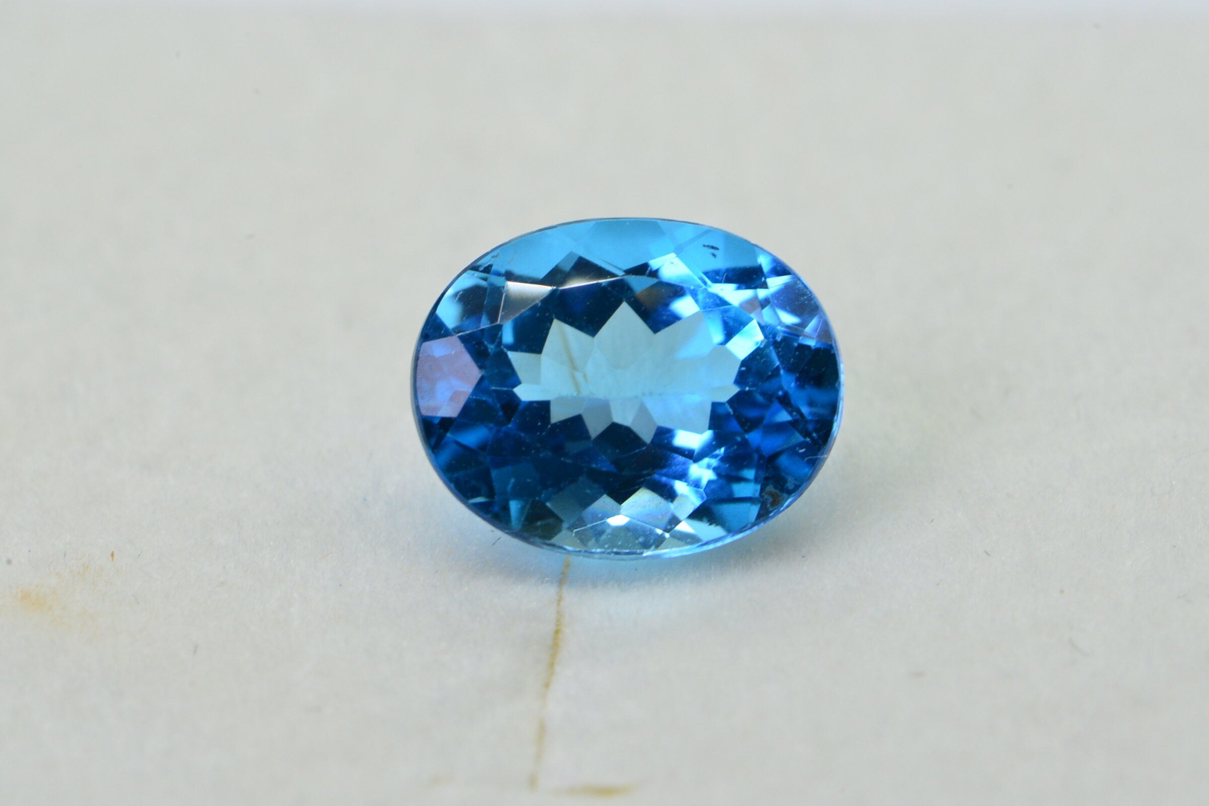 AAA Blue Topaz: Oval Faceted November Birthstone (8X10X5.2mm)