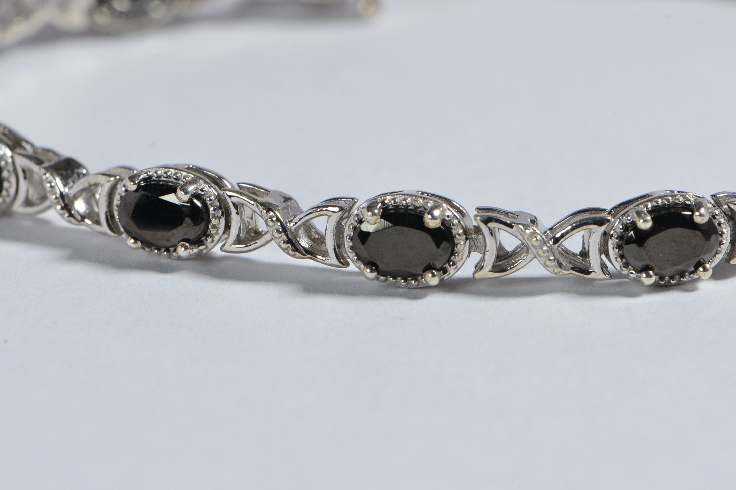 Black Spinel Tennis Bracelet: Oval Gemstone, Sterling Silver