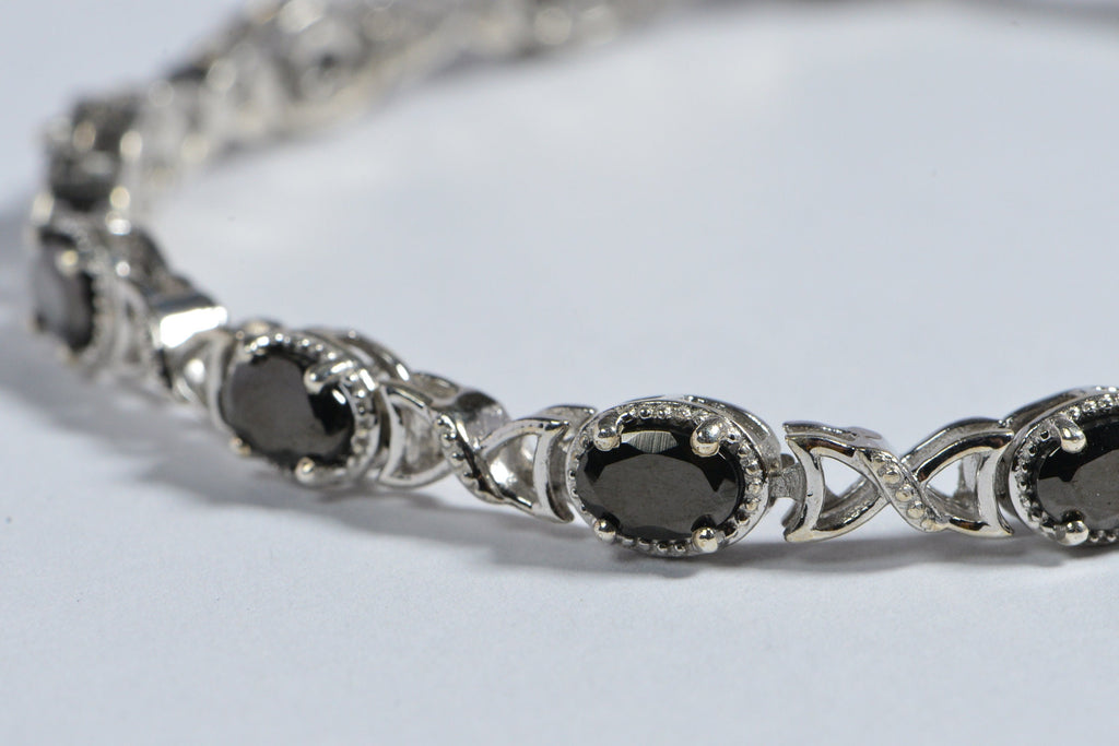 Black Spinel Tennis Bracelet: Oval Gemstone, Sterling Silver
