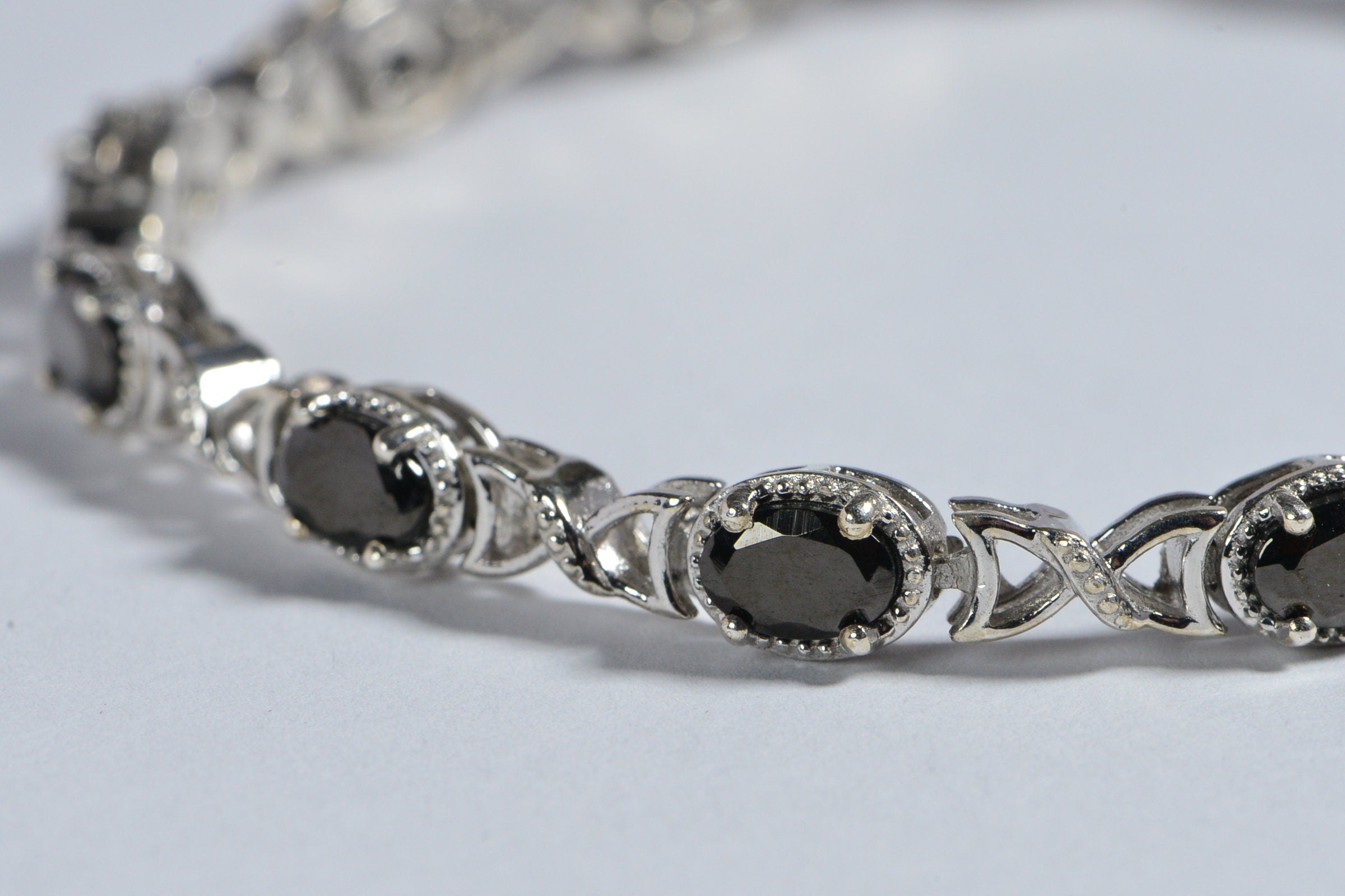 Black Spinel Tennis Bracelet: Oval Gemstone, Sterling Silver