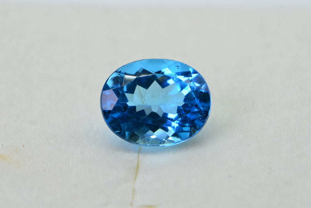 AAA Blue Topaz: Oval Faceted November Birthstone (8X10X5.2mm)