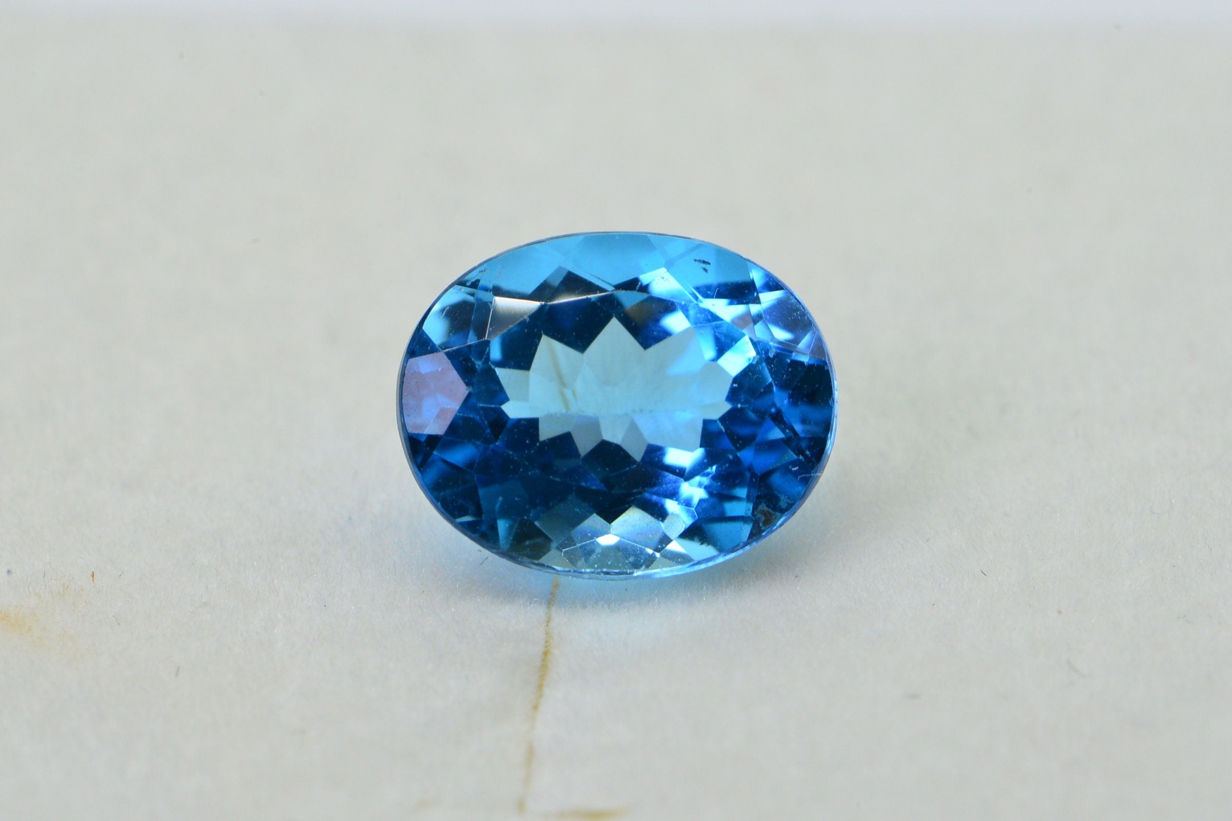 AAA Blue Topaz: Oval Faceted November Birthstone (8X10X5.2mm)
