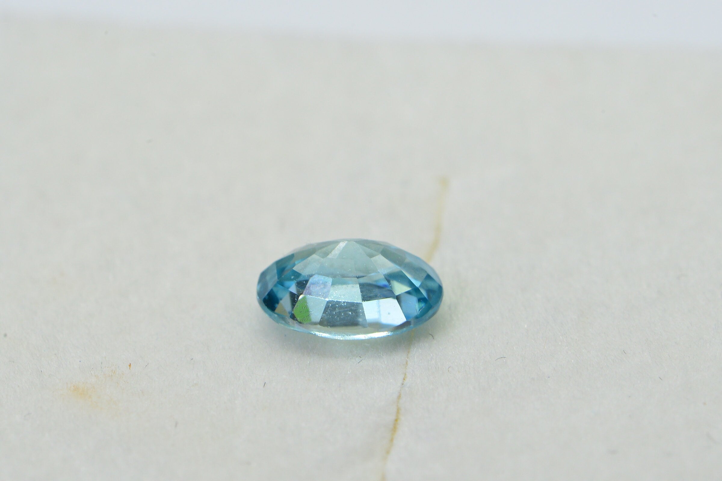 Aqua Blue Topaz: Oval Faceted Cabochon, November Birthstone