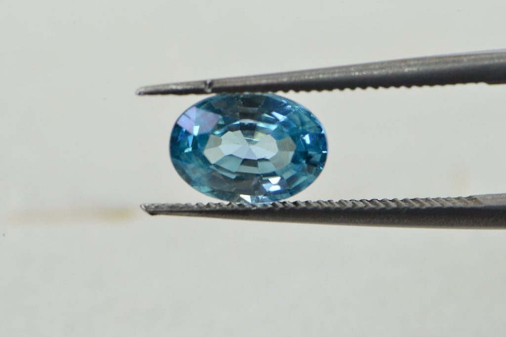 Aqua Blue Topaz: Oval Faceted Cabochon, November Birthstone
