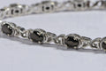 Black Spinel Tennis Bracelet: Oval Gemstone, Sterling Silver
