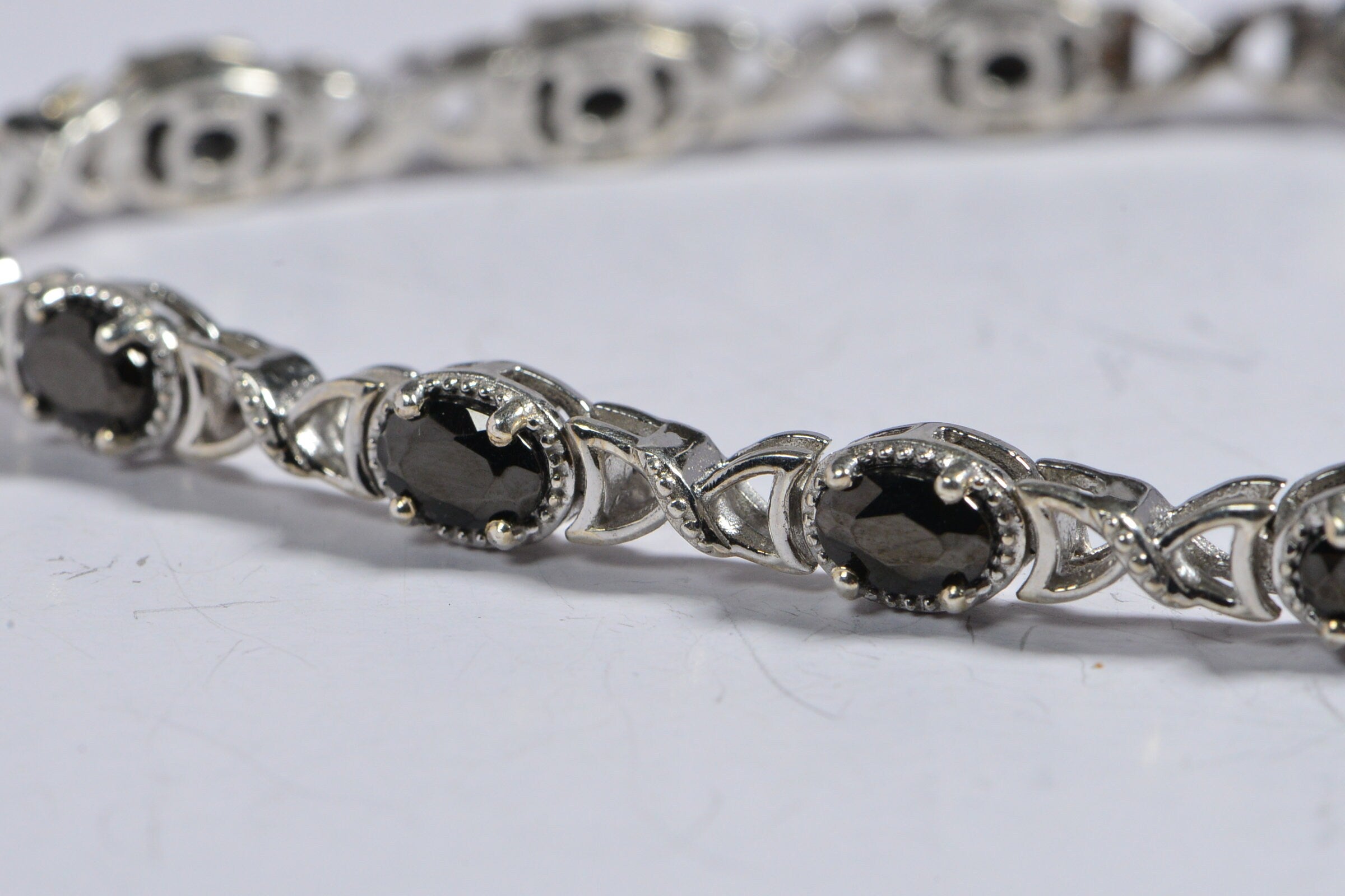Black Spinel Tennis Bracelet: Oval Gemstone, Sterling Silver