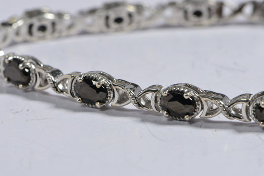 Black Spinel Tennis Bracelet: Oval Gemstone, Sterling Silver