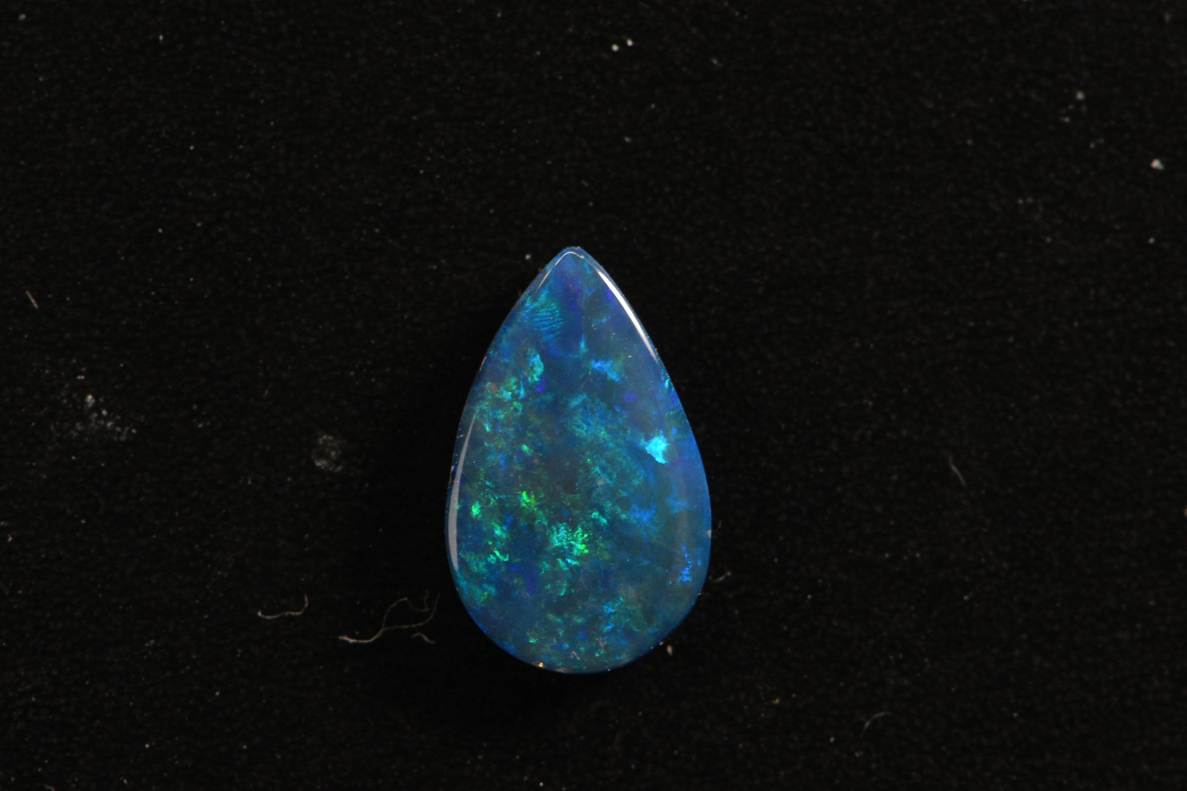 Australian Black Opal Doublet: Pear Cabochon Gemstone, 0.45ct