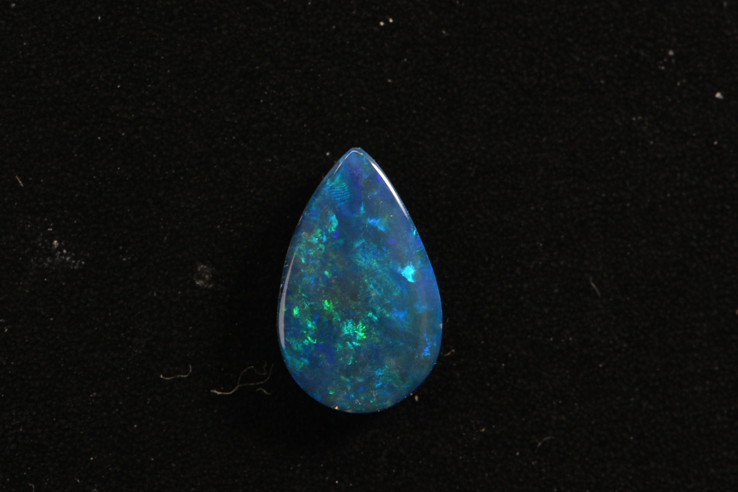 Australian Black Opal Doublet: Pear Cabochon Gemstone, 0.45ct