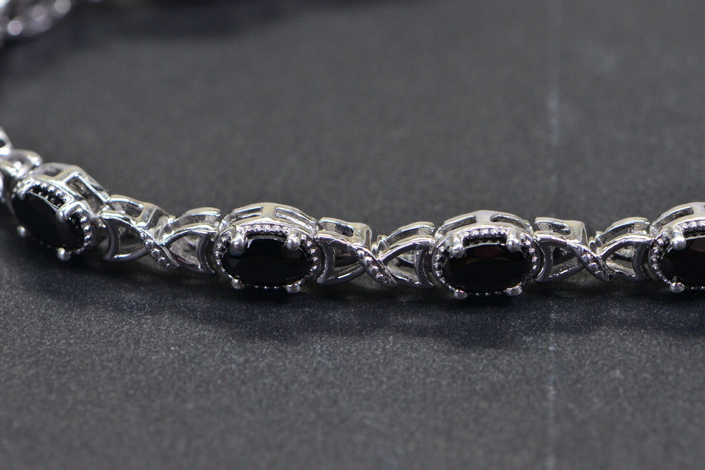 Black Spinel Tennis Bracelet: Oval Gemstone, Sterling Silver