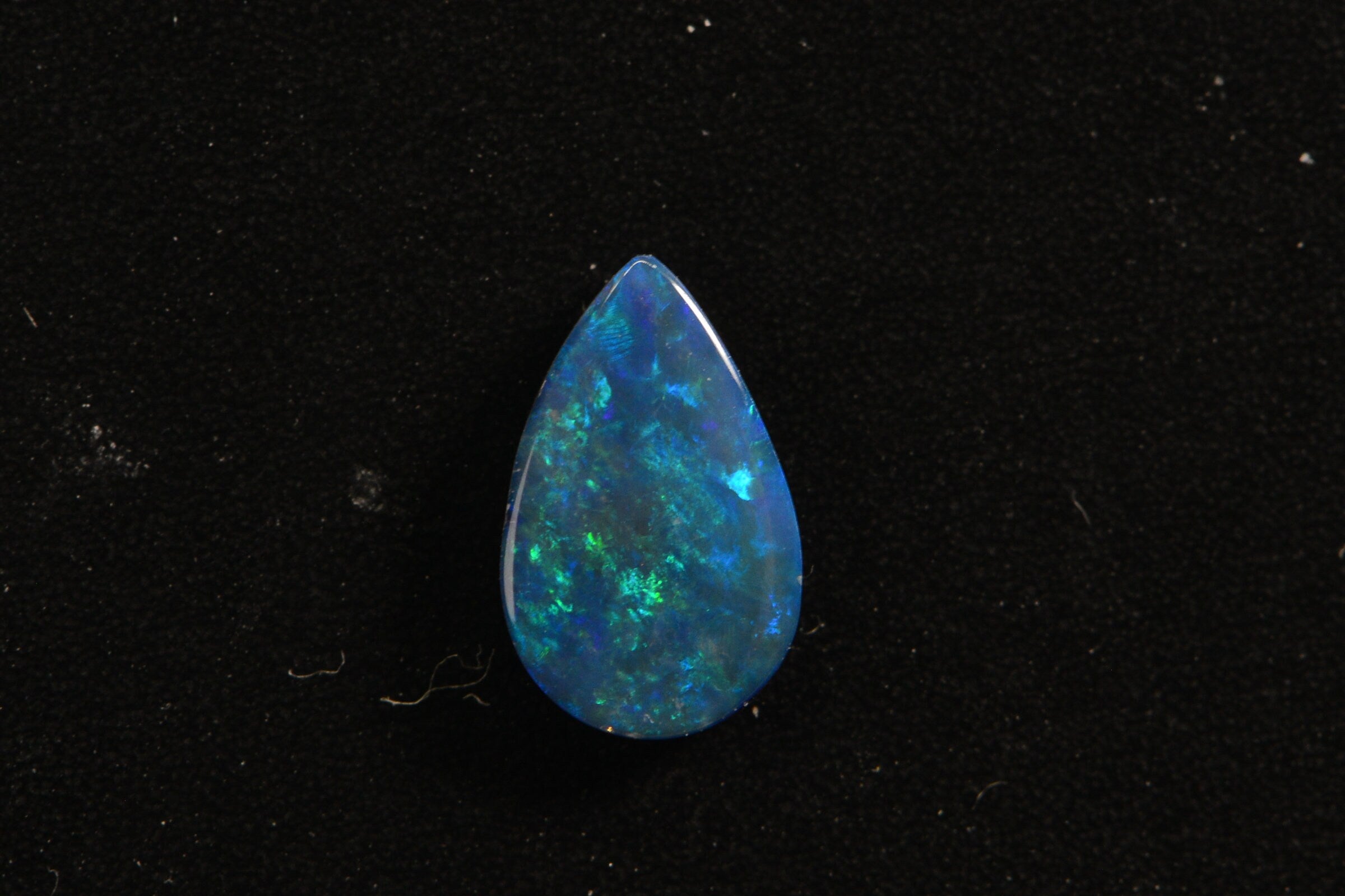 Australian Black Opal Doublet: Pear Cabochon Gemstone, 0.45ct