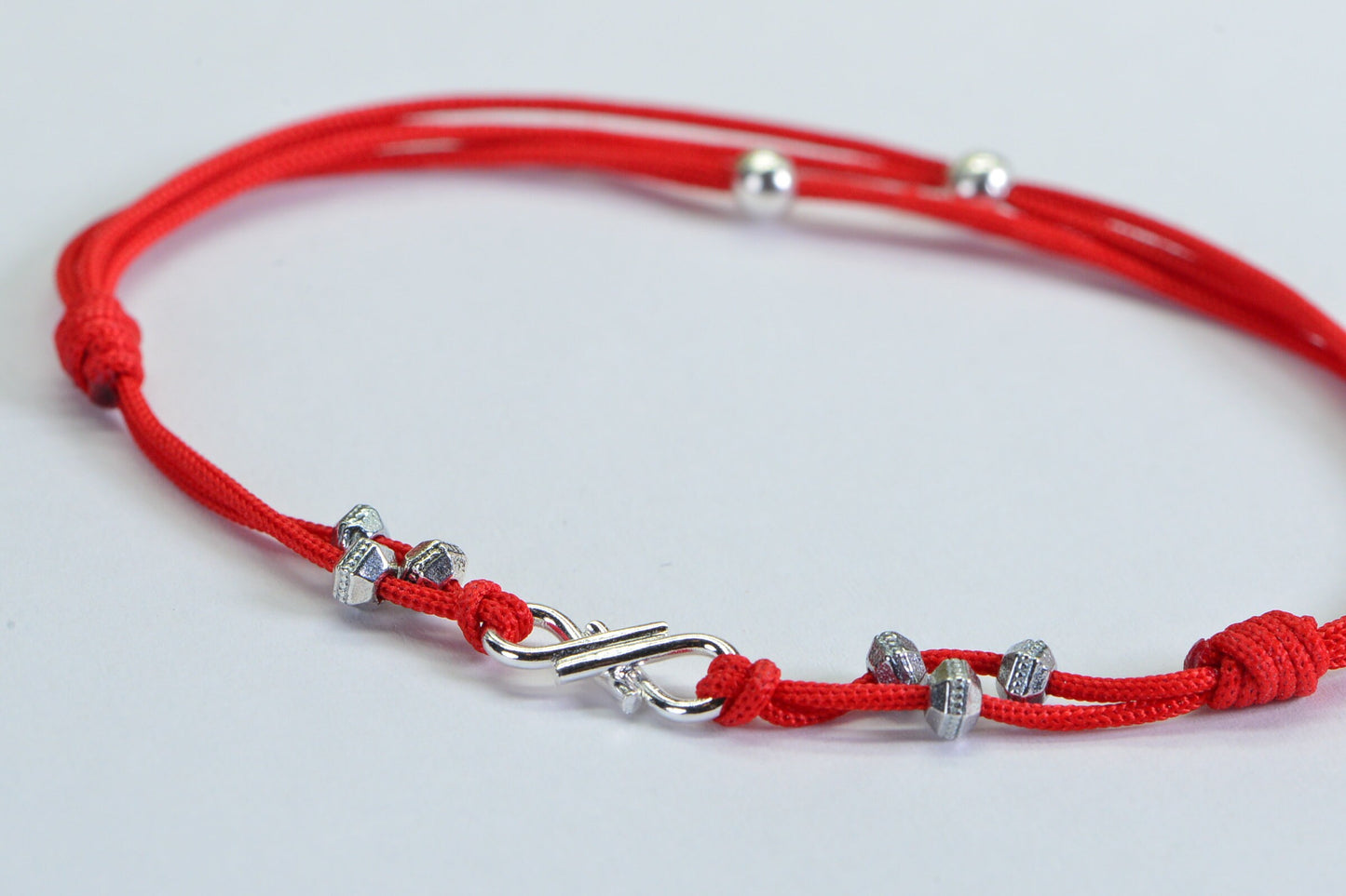 Red Braided Cord Bracelet: Sterling Silver Plated Infinity Charm