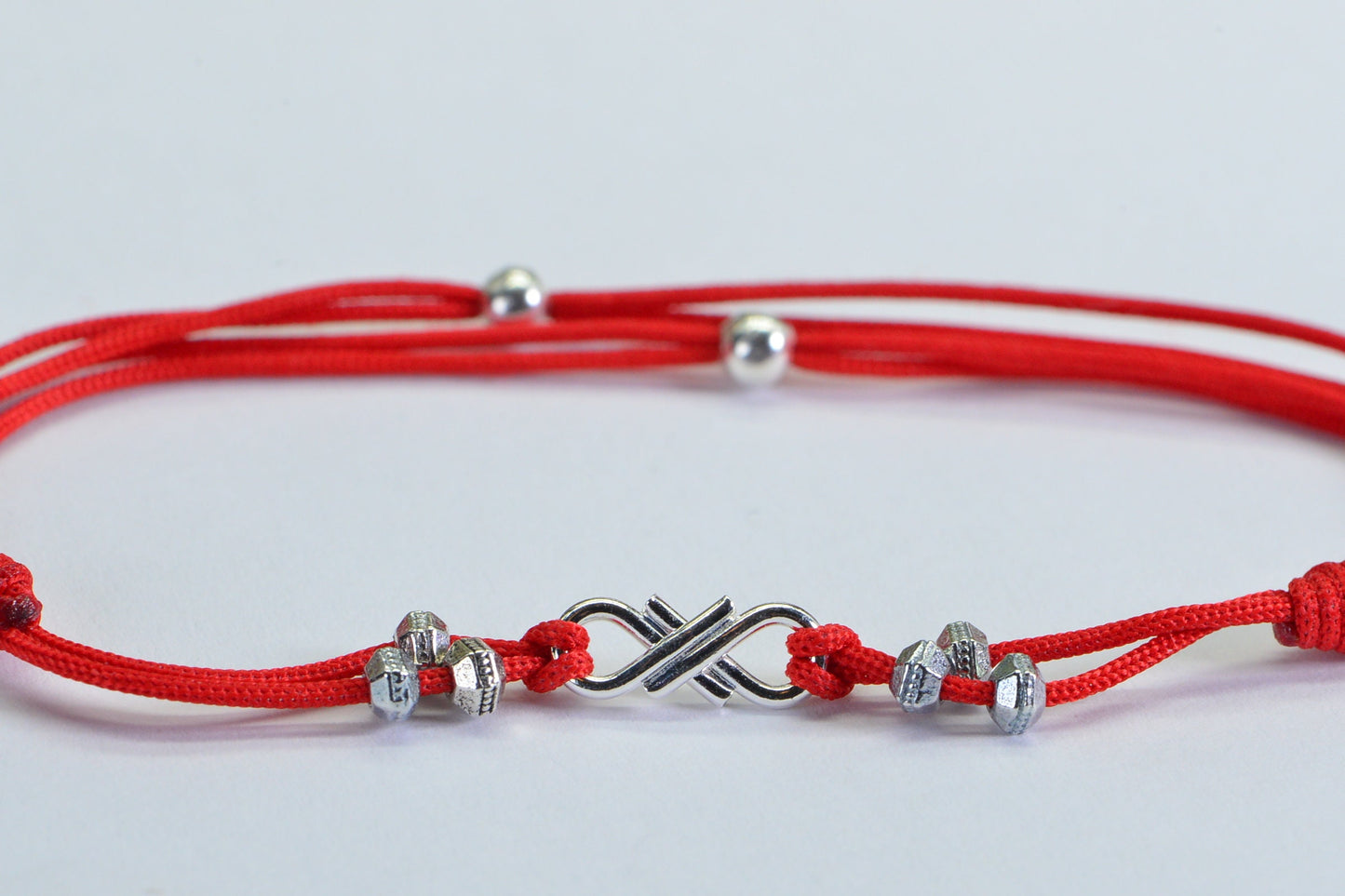Red Braided Cord Bracelet: Sterling Silver Plated Infinity Charm