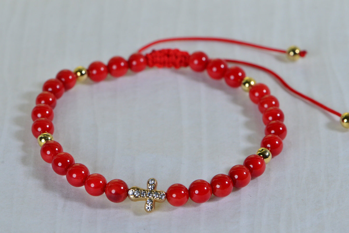 Red Coral Macrame Bracelet: Adjustable Knotted Cord, Gold Cross