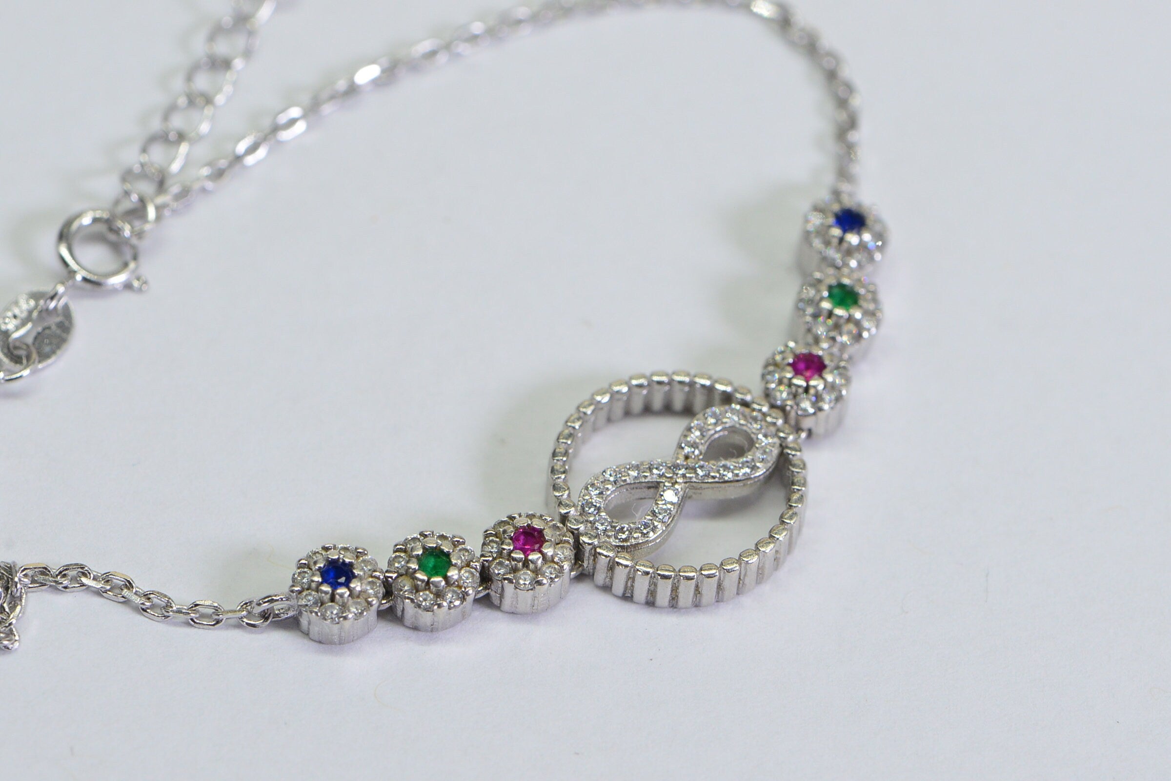 Sterling Silver Infinity Bracelet: Simulated Diamond, Ruby, Sapphire, Emerald
