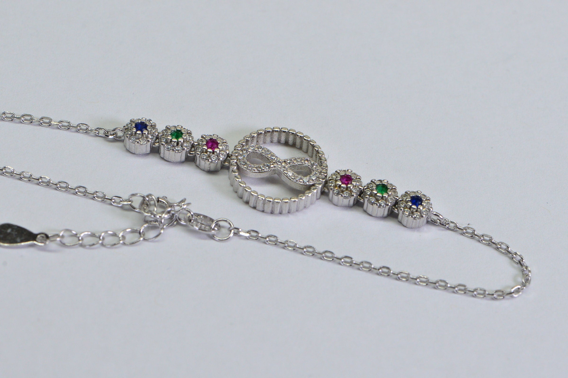 Sterling Silver Infinity Bracelet: Simulated Diamond, Ruby, Sapphire, Emerald