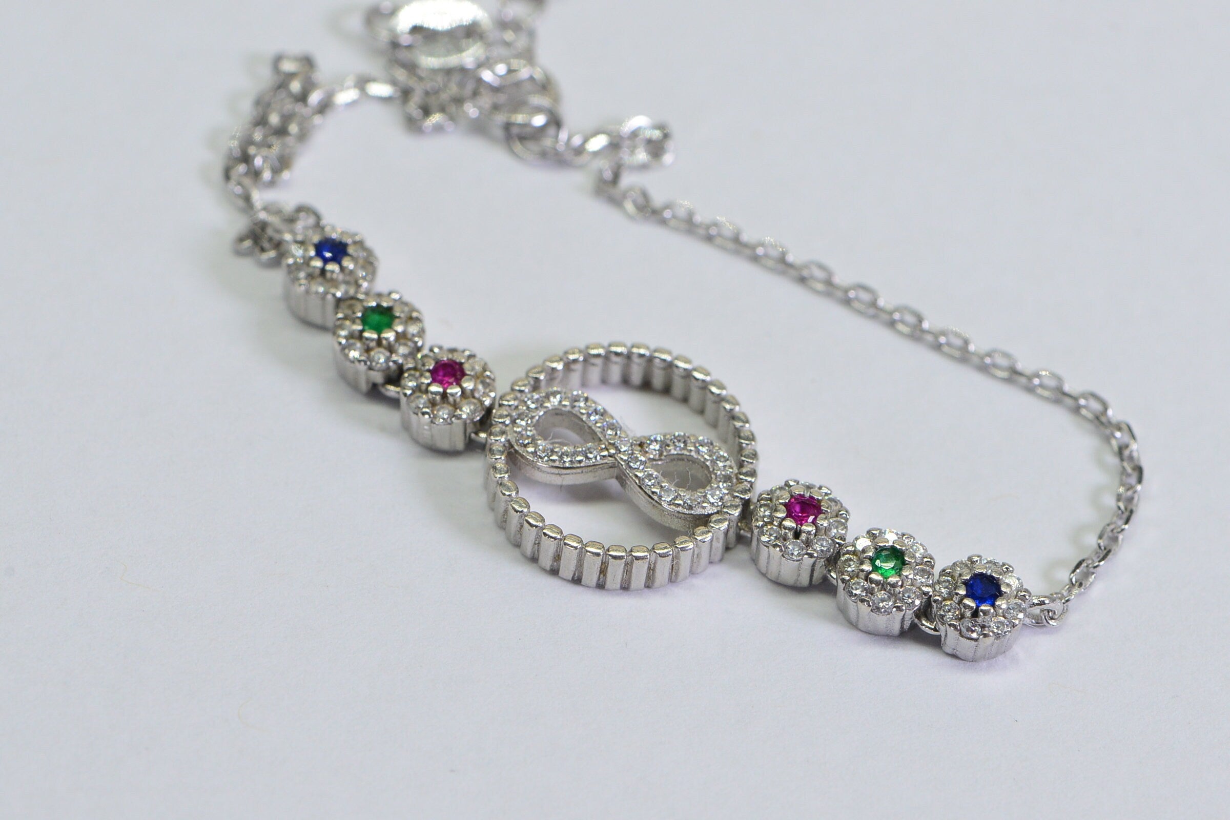 Sterling Silver Infinity Bracelet: Simulated Diamond, Ruby, Sapphire, Emerald