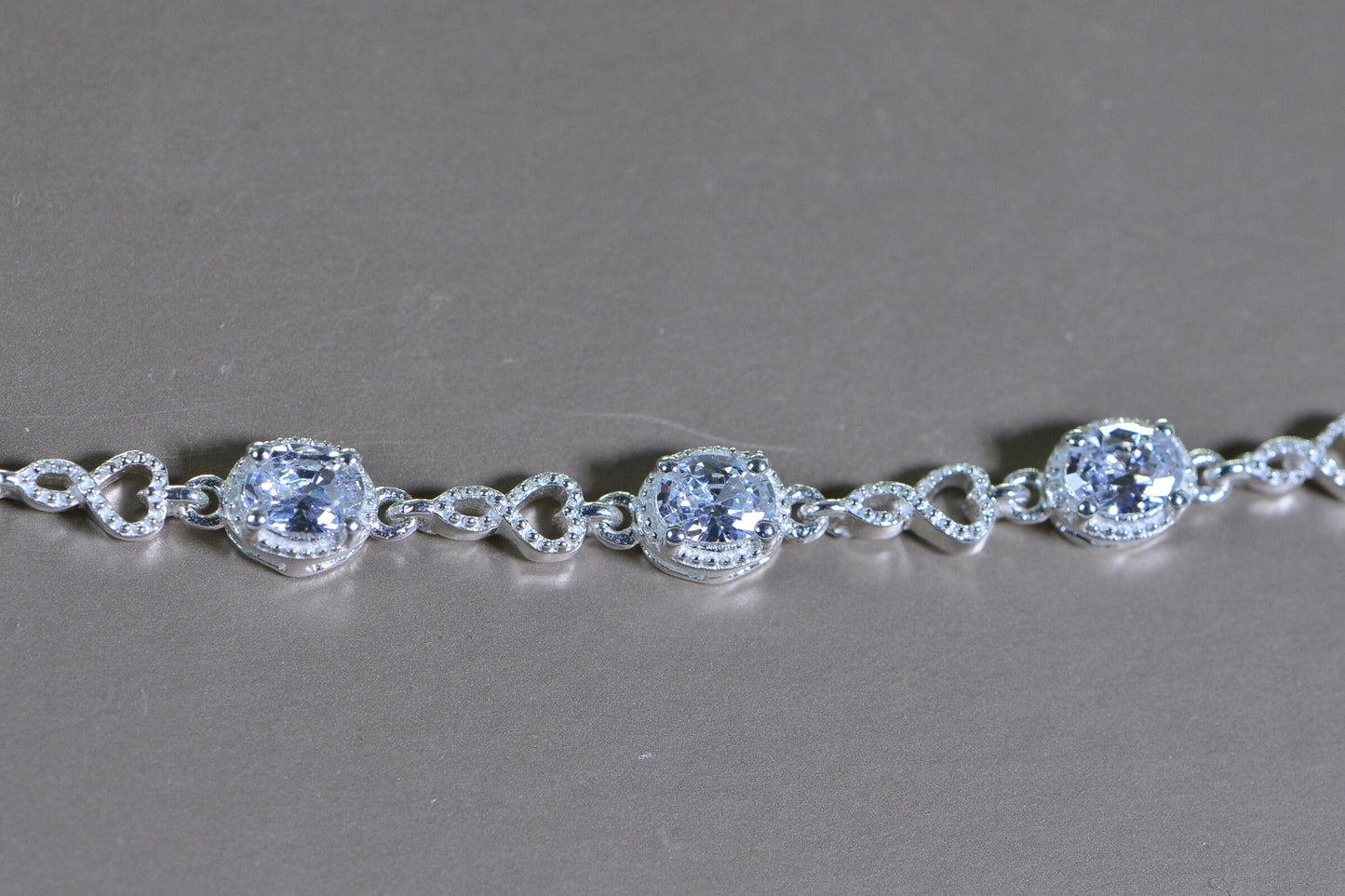 Simulated Diamond Tennis Bolo Bracelet: Rhodium Sterling Silver, Milgrain Infinity