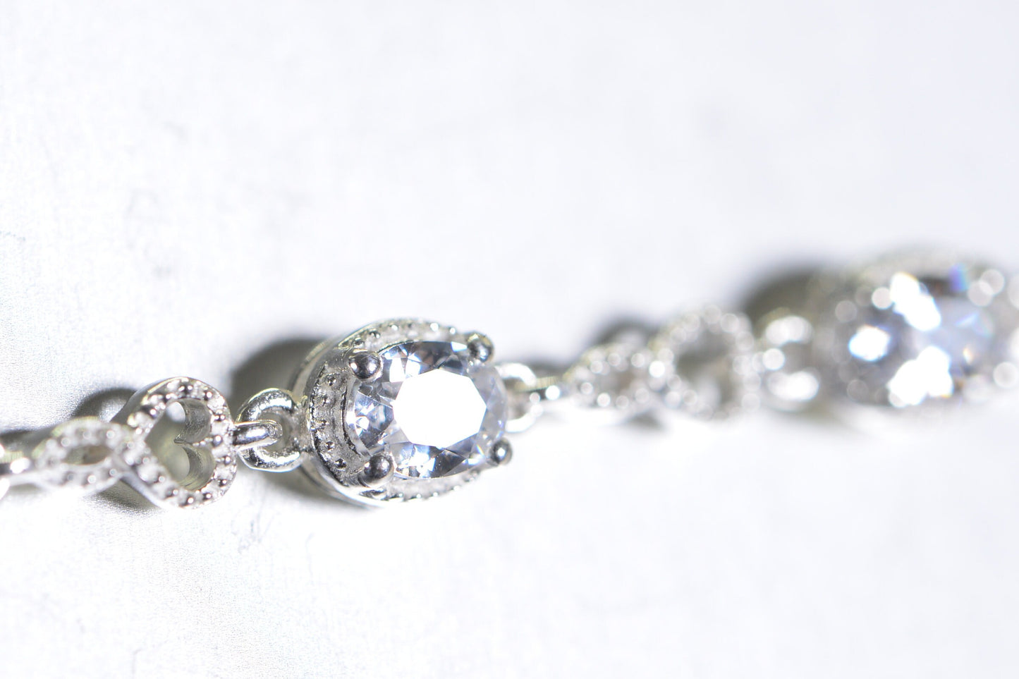Simulated Diamond Tennis Bolo Bracelet: Rhodium Sterling Silver, Milgrain Infinity