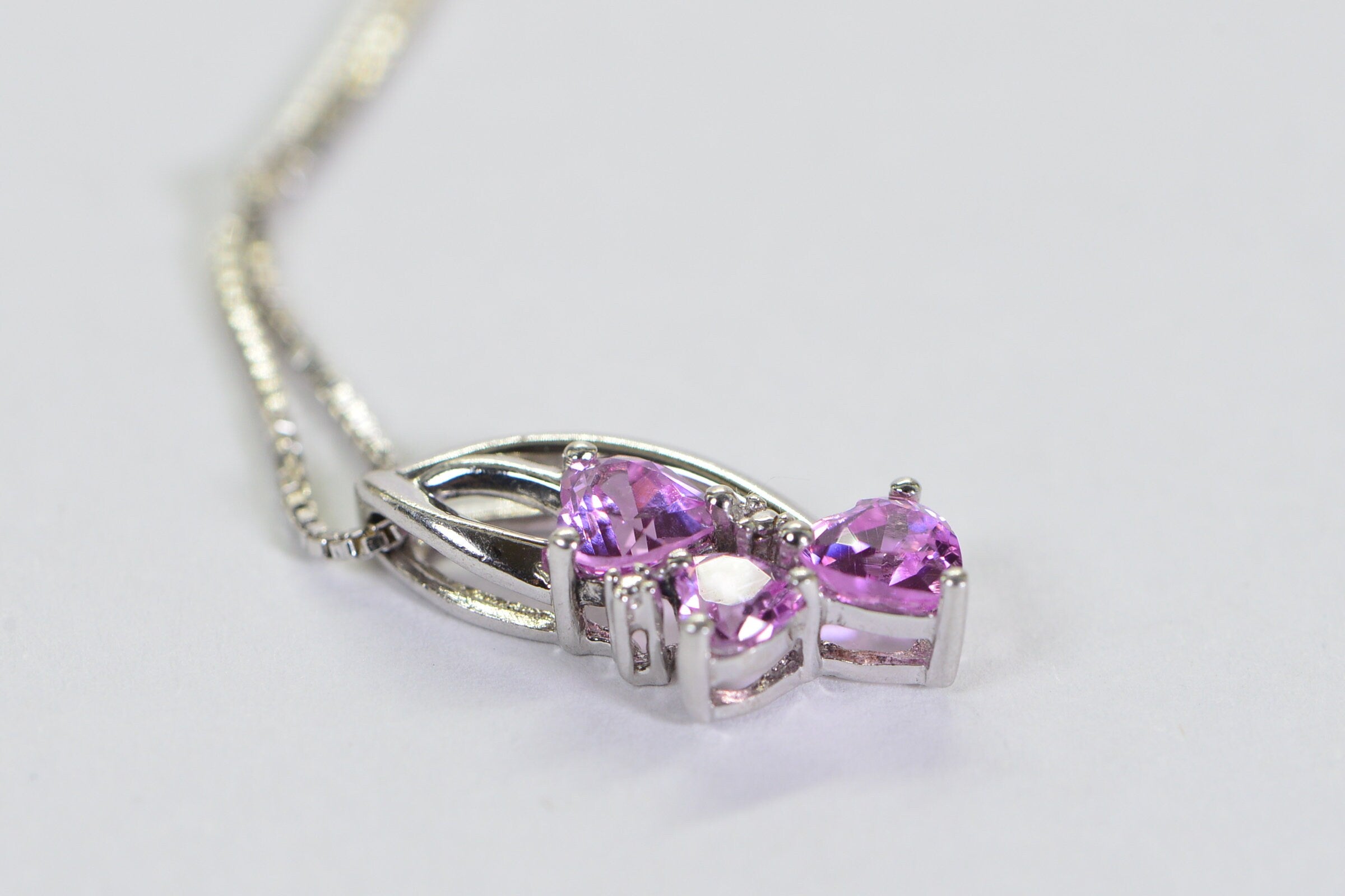 Pink Sapphire Three Hearts Pendant: Rhodium Sterling Silver Necklace